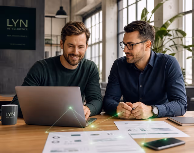 Two colleagues working together on connected enterprise data on a laptop